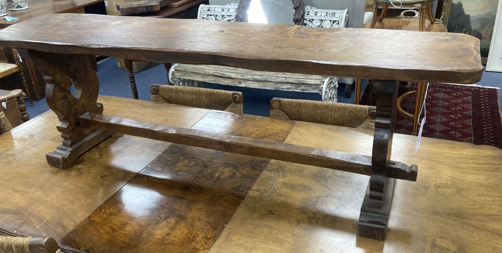 A 17th century style oak bench, length 138cm, depth 29cm, height 44cm